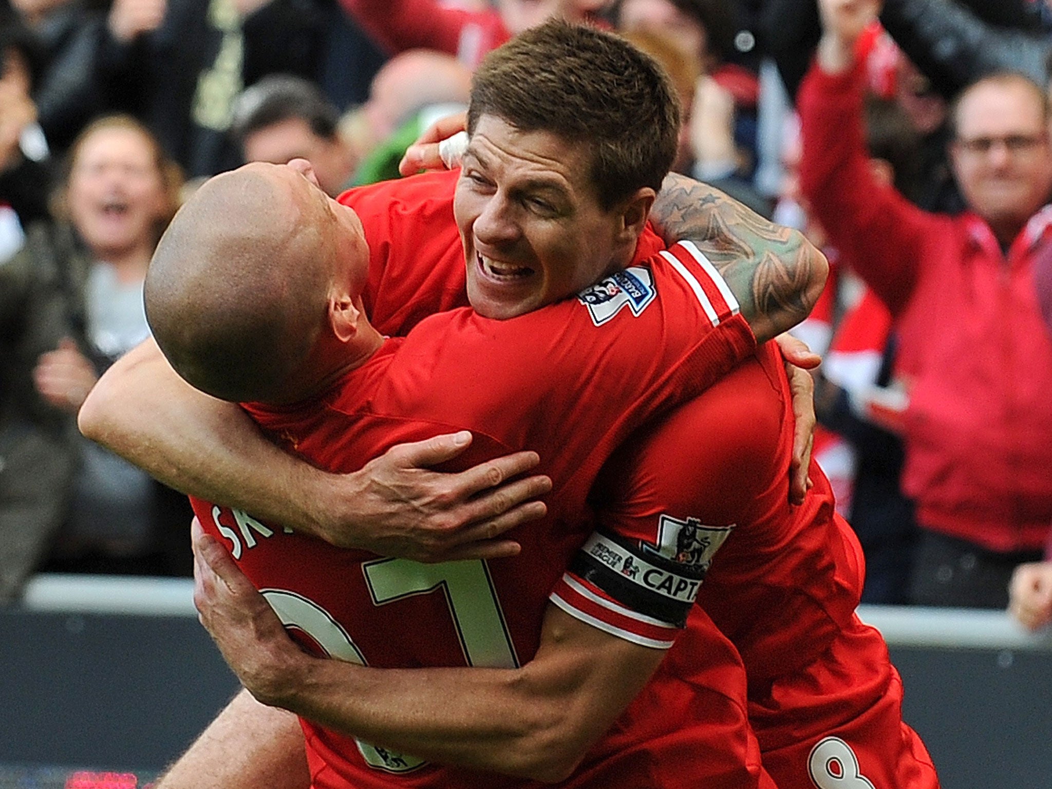 Steven Gerrard celebrates with Martin Skrtel after the defender made it 2-0 in the win over Manchester City